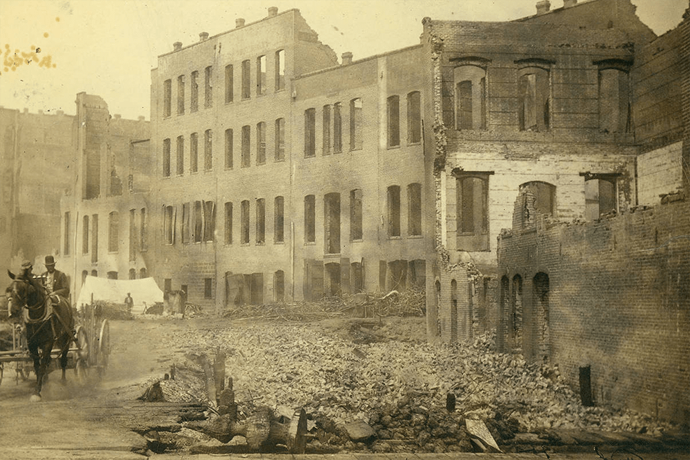 Aftermath of the fire of June 6, 1889, showing the ruins of buildings along 1st Ave. from Columbia to Yesler, Seattle, Washington