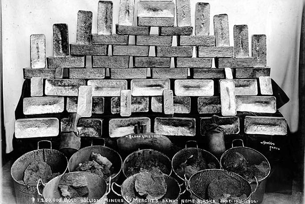 Gold bricks and buckets of gold ore belonging to the Miner's and Merchant's Bank, Nome, June 10, 1906